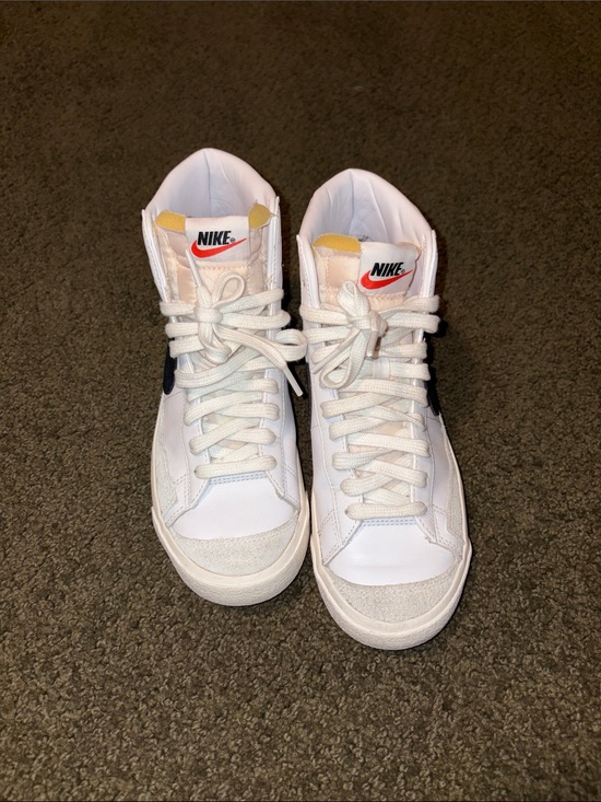 Nike Shoes - Nike Women's White High-Top Sneakers with Black Swoosh and Orange Logo Accents